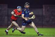 11 February 2025; Padraig Lennon of DCU in action against Cathal McCarthy of UCC during the Electric Ireland HE GAA Fitzgibbon Cup semi-final match between University College Cork and Dublin City University Dóchas Éireann at SETU Carlow Campus in Carlow. Photo by Matt Browne/Sportsfile