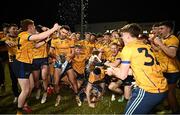 12 February 2025; DCU captain Ciarán Caulfield with the cup as he celebrates with team-mates after their side's victory in the Electric Ireland Higher Education GAA Sigerson Cup final match between UCD and DCU DÉ at the GAA Connacht Centre of Excellence in Bekan, Mayo. Photo by Piaras Ó Mídheach/Sportsfile