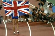 28 August 2004; Kelly Holmes of Great Britain celebrates winning Gold in the Women's 1500m Final. Olympic Stadium. Games of the XXVIII Olympiad, Athens Summer Olympics Games 2004, Athens, Greece. Picture credit; Brendan Moran / SPORTSFILE