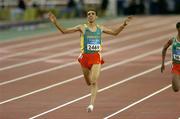 28 August 2004; Morocco's Hicham El Guerrouj celebrates after winning Gold in the Final of the Men's 5000m. Olympic Stadium. Games of the XXVIII Olympiad, Athens Summer Olympics Games 2004, Athens, Greece. Picture credit; Brendan Moran / SPORTSFILE