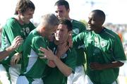 4 September 2004; Robbie Keane, Republic of Ireland, is congratulated by team-mates Clinton Morrison (right), John O'Shea (back), Graham Kavanagh (2nd from left) and Kevin Kilbane (left) after scoring his sides third goal from the penalty spot. FIFA World Cup Qualifier, Republic of Ireland v Cyprus, Lansdowne Road, Dublin. Picture credit; Brendan Moran / SPORTSFILE