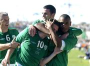 4 September 2004; Robbie Keane, Republic of Ireland, is congratulated by team-mates Clinton Morrison (right), John O'Shea (back) and Graham Kavanagh (left) after scoring his sides third goal from the penalty spot. FIFA World Cup Qualifier, Republic of Ireland v Cyprus, Lansdowne Road, Dublin. Picture credit; Brendan Moran / SPORTSFILE