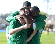 4 September 2004; Robbie Keane, Republic of Ireland, is congratulated by team-mates Clinton Morrison and John O'Shea after scoring his sides third goal from the penalty spot. FIFA World Cup Qualifier, Republic of Ireland v Cyprus, Lansdowne Road, Dublin. Picture credit; Brendan Moran / SPORTSFILE
