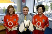 6 September 2004; Business as Usual .... NOT! . The staff of ACC Bank in Cork ensuring that staff member Joe Deane is starting his preparations early for Sunday's Guinness All-Ireland Hurling Final against Kilkenny. Pictured with Joe are ACC Bank staff, Liz O'Connor, left, and Susan Walsh. Picture credit; Brendan Moran / SPORTSFILE