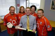 6 September 2004; Business as Usual .... NOT! . The staff of ACC Bank in Cork ensuring that staff member Joe Deane is starting his preparations early for Sunday's Guinness All-Ireland Hurling Final against Kilkenny. Pictured with Joe are ACC Bank staff, from left, John Cunningham, Business Unit Manager, Liz O'Connor, Susan Walsh and Bernard Gould, Regional Director. Picture credit; Brendan Moran / SPORTSFILE