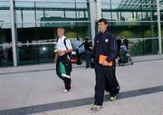 6 September 2004; Roy Keane, Republic of Ireland, with team-mate Graham Kavanagh arrive at the euro airport , Basel, ahead of their forthcoming 2006 World Cup Qualifying Game with Switzerland. Basel, Switzerland. Picture credit; David Maher / SPORTSFILE