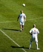 7 September 2004; The Republic of Ireland's Stephen Carr practices his ball control with team-mate Graham Kavanagh, bottom, during squad training. St. Jakob Park, Basle, Switzerland. Picture credit; Brian Lawless / SPORTSFILE