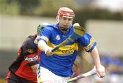 28 August 2004; Tommy Fitzgerald, Tipperary, in action against Aaron Dynes, Down. Erin All-Ireland U21 Hurling Championship Semi-Final, Tipperary v Down, O'Moore Park, Portlaoise, Co. Laois.  Picture credit; Matt Browne / SPORTSFILE