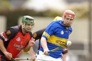 28 August 2004; Tommy Fitzgerald, Tipperary, in action against Aaron Dynes, Down. Erin All-Ireland U21 Hurling Championship Semi-Final, Tipperary v Down, O'Moore Park, Portlaoise, Co. Laois.  Picture credit; Matt Browne / SPORTSFILE