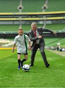 1 October 2013; Politicians vs the Hacks! ESB Charity Challenge 2013. With just weeks to go before the budget, TDs and senators are not only readying themselves for criticism from the public but are in training for a battle against reporters. Both sides have agreed to a showdown of football talents (or lack of) in the Aviva stadium on October 25th, in a bid to raise much needed funds for Temple Street Children's University Hospital and Concern Worldwide. The event is proudly supported by ESB. TDs, senators and a range of political reporters and news correspondents from the print and broadcast media attended the launch in the stadium yesterday, with FAI chief executive John Delaney and the competition trophy. The FAI are providing use of Aviva Stadium for the politician and journalist fundraising inititiative on October 25 through their relationship with the Oireachtas Republic of Ireland Supporters club. Pictured at the announcement are Derek McDonnell, age 11, from Donard, Dublin, and FAI Chief Executive John Delaney at the launch of the Oireachtas versus Journalists ESB Charity Challenge 2013. Aviva Stadium, Lansdowne Road, Dublin. Picture credit: Barry Cregg / SPORTSFILE