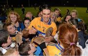 2 October 2013; Clare supporters gather around for autographs and photoraphs with Clare's Brendan Bugler after the game. GOAL Challenge, Clare A v Clare B, Sixmilebridge, Co. Clare. Picture credit: Diarmuid Greene / SPORTSFILE