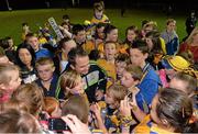 2 October 2013; Clare supporters gather around for autographs and photoraphs with Clare manager Davy Fitzgerald after the game. GOAL Challenge, Clare A v Clare B, Sixmilebridge, Co. Clare. Picture credit: Diarmuid Greene / SPORTSFILE