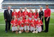 28 September 2013; Uachtarán Chumann Lœthchleas Gael Liam î NŽill, left, and President of the Camogie Association Aileen Lawlor with the Cork camogie team, back row, left to right, Alanna Williams, St. Brendan's NS, Portumna, Co. Galway, Michelle Cullen, Scoil Mhuire, Broadway, Co Wexford, Lisa O'Riordan, Scoil an Athar Tadhg, Carraig Na Bhfear, Co Chorcai, Sheila McGrath, Loretto College, Mullingar, Co. Westmeath, Orla Martin, St Pius X G.N.S. Templeogue, Dublin 6W, front row, left to right, Laura Henley, BCS Lismore, Co. Waterford, Olivia Glynn, Loretto College, Mullingar, Co. Westmeath, Hannah O'Leary, Cloghroe NS, Blarney, Co. Cork, Catherine Walsh, St. Peter's NS, Dungourney, Co. Cork, Almha O'Rourke, Mercy Convent Primary School, Naas, Co. Kildare. INTO/RESPECT Exhibition GoGames during the GAA Hurling All-Ireland Senior Championship Final Replay between Cork and Clare, Croke Park, Dublin. Picture credit: Daire Brennan / SPORTSFILE