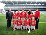 28 September 2013; Uachtarán Chumann Lœthchleas Gael Liam î NŽill, left, and President of the Camogie Association Aileen Lawlor with the Cork hurling team, back row, left to right, Ryan McCarthy, St. Fergal's N.S., Killeagh, Co. Cork, Tomas Harrington, Star of the Sea, Passage West, Co. Cork, Kieran Conroy, Paddock N.S., Mountrath, Co. Laois, Michael O'Neill, Scoil na Trocaire, Buttevant, Co. Cork, Cian Fitzsimons, St Patrick's Ballygalget P.S., Portaferry, Co. Down, front row, left to right, Kevin O'Brien, Ballintotis N.S., Ballintotis, Castlemartyr, Co. Cork, Cian Sparling, St. Nicholas N.S., Adare, Co. Limerick, Tiarnan O'Rourke, St Corbans N.S., Naas, Co. Kildare, Ois’n Larkin, St. Brendan's N.S., Portumna, Co. Galway, Chad Brennan, Holy Trinity N.S., Donaghmede, Dublin 5. INTO/RESPECT Exhibition GoGames during the GAA Hurling All-Ireland Senior Championship Final Replay between Cork and Clare, Croke Park, Dublin. Picture credit: Daire Brennan / SPORTSFILE