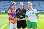 29 September 2013; Team captains Kellie Kearney, Wexford, and Siobhan Flannery, Offaly, shake hands in the company of referee Michael John O'Keeffe before the game. TG4 All-Ireland Ladies Football Junior Championship Final, Offaly v Wexford, Croke Park, Dublin. Picture credit: Brendan Moran / SPORTSFILE