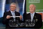 3 October 2013; Simon Moroney, CEO of the Munster Council, in the company of Robert Frost, right, Chairman of the Munster Council, pulls out the name of Kerry while making the draw for the GAA Munster Senior Football Championship, during the 2014 GAA Senior Provincial Championship Draw. Croke Park, Dublin. Picture credit: Matt Browne / SPORTSFILE
