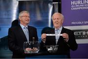 3 October 2013; Robert Frost, right, Chairman of the Munster Council, in the company of Simon Moroney, CEO of the Munster Council, pulls out the name of Waterford while making the draw for the GAA Munster Senior Hurling Championship, during the 2014 GAA Senior Provincial Championship Draw. Croke Park, Dublin. Picture credit: Matt Browne / SPORTSFILE