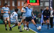 14 February 2025; Ethan Black of St Michael's College kicks on despite pressure from Paddy Clancy of Blackrock College during the Bank of Ireland Leinster Rugby Boys Schools Senior Cup second round match between Blackrock College and St Michael's College at Energia Park in Dublin. Photo by Shauna Clinton/Sportsfile