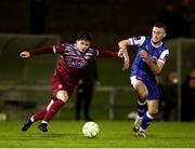 14 February 2025; Lee Devitt of Treaty United in action against Luka Le Bervet of Cobh Ramblers during the SSE Airtricity Men's First Division match between Treaty United and Cobh Ramblers at Markets Field in Limerick. Photo by Michael P Ryan/Sportsfile