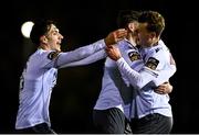 14 February 2025; James Crawford of Wexford, right, celebrates with team-mates Jack Larkin, centre, and Zayd Abada  after scoring their side's first goal during the SSE Airtricity Men's First Division match between UCD and Wexford at UCD Bowl in Belfield, Dublin. Photo by Tyler Miller/Sportsfile