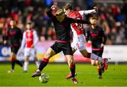 14 February 2025; Barry Baggley of St Patrick's Athletic in action against Josh Thomas of Drogheda United during the SSE Airtricity Men's Premier Division match between St Patrick's Athletic and Drogheda United at Richmond Park in Dublin. Photo by Shauna Clinton/Sportsfile