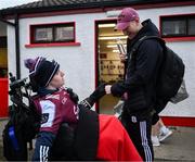 15 February 2025; Johnny Heaney of Galway with Galway supporter Tómas McLoughlin, from Corofin, before the Allianz Football League Division 1 match between Derry and Galway at Celtic Park in Derry. Photo by Ramsey Cardy/Sportsfile