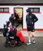 15 February 2025; Connor Gleeson of Galway with Galway supporter Tómas McLoughlin, from Corofin, before the Allianz Football League Division 1 match between Derry and Galway at Celtic Park in Derry. Photo by Ramsey Cardy/Sportsfile