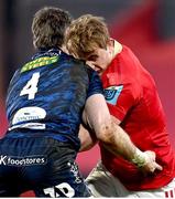 15 February 2025; Gavin Coombes of Munster is tackled by Max Douglas of Scarlets during the United Rugby Championship match between Munster and Scarlets at Thomond Park in Limerick. Photo by David Fitzgerald/Sportsfile