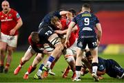 15 February 2025; Gavin Coombes of Munster is tackled by Max Douglas of Scarlets during the United Rugby Championship match between Munster and Scarlets at Thomond Park in Limerick. Photo by David Fitzgerald/Sportsfile