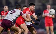 15 February 2025; Conor Doherty of Derry in action against John Maher, left, and Shane Walsh of Galway during the Allianz Football League Division 1 match between Derry and Galway at Celtic Park in Derry. Photo by Ramsey Cardy/Sportsfile