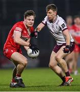 15 February 2025; Ethan Doherty of Derry in action against Dylan McHugh of Galway during the Allianz Football League Division 1 match between Derry and Galway at Celtic Park in Derry. Photo by Ramsey Cardy/Sportsfile