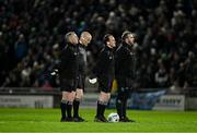 15 February 2025; Line umpire David Coldrick, third from left, stands alongside his colleagues, referee Liam Devenney, line umpire Derek O'Mahoney and sideline official Donnacha O'Callaghan, for a minute's silence in memory of his late father Benny, before the Allianz Football League Division 1 match between Kerry and Dublin at Austin Stack Park in Tralee, Kerry. Also remembered were the late Dublin goalkeeper and manager Paddy Cullen, former Dublin County Board chairman Con Clarke, and brother of Austin Stack Park Steward Joe Wallace, Jeremiah Wallace. Photo by Brendan Moran/Sportsfile