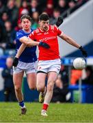 16 February 2025; Val Leddy of Louth in action against Oisin Kiernan of Cavan during the Allianz Football League Division 2 match between Cavan and Louth at Kingspan Breffni Park in Cavan. Photo by Ray McManus/Sportsfile