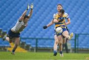 16 February 2025; Diarmuid Murtagh of Roscommon in action against Killian Lavelle of Monaghan during the Allianz Football League Division 2 match between Roscommon and Monaghan at King & Mofatt Dr Hyde Park in Roscommon. Photo by Stephen Marken/Sportsfile
