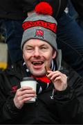 16 February 2025; Louth and Dundalk FC supporter Harry Mathews, from Dundalk in Louth, enjoys a cup of tea before the Allianz Football League Division 2 match between Cavan and Louth at Kingspan Breffni Park in Cavan. Photo by Ray McManus/Sportsfile