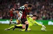 16 February 2025; Shamrock Rovers goalkeeper Ed McGinty gathers possession ahead of Colm Whelan of Bohemians during the SSE Airtricity Men's Premier Division match between Bohemians and Shamrock Rovers at the Aviva Stadium in Dublin. Photo by Ben McShane/Sportsfile