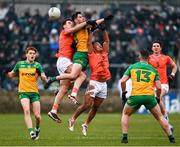 16 February 2025; Ryan McHugh of Donegal in action against Niall Grimley, left, and Jemar Hall of Armagh during the Allianz Football League Division 1 match between Donegal and Armagh at MacCumhaill Park in Ballybofey, Donegal. Photo by Ramsey Cardy/Sportsfile