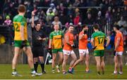 16 February 2025; Aidan Forker of Armagh is shown a red card by referee Sean Hurson during the Allianz Football League Division 1 match between Donegal and Armagh at MacCumhaill Park in Ballybofey, Donegal. Photo by Ramsey Cardy/Sportsfile