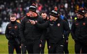 16 February 2025; Armagh manager Kieran McGeeney, right, and selector Kieran Donaghy leave the pitch at half-time of the Allianz Football League Division 1 match between Donegal and Armagh at MacCumhaill Park in Ballybofey, Donegal. Photo by Ramsey Cardy/Sportsfile