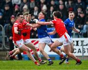 16 February 2025; Ciarán Brady of Cavan is tackled by James Smith, left, and Oisin Kiernan of Cavan during the Allianz Football League Division 2 match between Cavan and Louth at Kingspan Breffni Park in Cavan. Photo by Ray McManus/Sportsfile
