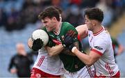 16 February 2025; Jordan Flynn of Mayo in action against Michael McKernan, right, and Shea O'Hare of Tyrone during the Allianz Football League Division 1 match between Mayo and Tyrone at Hastings Insurance MacHale Park in Castlebar, Mayo. Photo by Piaras Ó Mídheach/Sportsfile