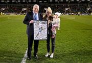 21 February 2025; Recently retired Republic of Ireland international Julie-Ann Russell and her daughter Rosie are presented with a plaque by FAI President Paul Cooke during the UEFA Women's Nations League B match between Republic of Ireland and Turkiye at Tallaght Stadium in Dublin. Photo by Stephen McCarthy/Sportsfile