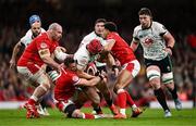 22 February 2025; Josh van der Flier of Ireland is tackled by Wales players, from left, WillGriff John, Elliot Dee and Ben Thomas during the Guinness Six Nations Rugby Championship match between Wales and Ireland at the Principality Stadium in Cardiff, Wales. Photo by Ben McShane/Sportsfile