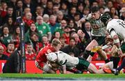 22 February 2025; Mack Hansen of Ireland is tackled by Blair Murray of Wales on the try line during the Guinness Six Nations Rugby Championship match between Wales and Ireland at the Principality Stadium in Cardiff, Wales. Photo by Seb Daly/Sportsfile