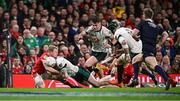 22 February 2025; Mack Hansen of Ireland is tackled by Blair Murray of Wales on the try line during the Guinness Six Nations Rugby Championship match between Wales and Ireland at the Principality Stadium in Cardiff, Wales. Photo by Seb Daly/Sportsfile