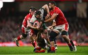 22 February 2025; Robbie Henshaw of Ireland is tackled by Wales players, from left, Elliot Dee, Ben Thomas and Taulupe Faletau during the Guinness Six Nations Rugby Championship match between Wales and Ireland at the Principality Stadium in Cardiff, Wales. Photo by Ben McShane/Sportsfile