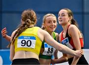 22 February 2025; Katie Bergin of Moyne AC, Tipperary, centre celebrates after winning the women's 200m final with Kate O'Connell of Lucan Harriers AC, Dublin, right, and Molly Hourihan of UCD AC, Dublin, left, who finished second and third respectively, during day one of the 123.ie National Senior Indoor Championships at the National Indoor Arena on the Sport Ireland Campus in Dublin. Photo by Sam Barnes/Sportsfile