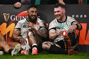 22 February 2025; Bundee Aki, left, and Peter O’Mahony of Ireland after the Guinness Six Nations Rugby Championship match between Wales and Ireland at the Principality Stadium in Cardiff, Wales. Photo by Ben McShane/Sportsfile