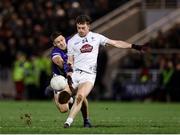 22 February 2025; Niall Kelly of Kildare kicks a point despite the efforts of Seamus Lacey of Laois during the Allianz Football League Division 3 match between Kildare and Laois at Cedral St Conleths Park in Newbridge, Kildare. Photo by Thomas Flinkow/Sportsfile
