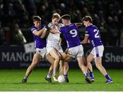 22 February 2025; Daniel Flynn of Kildare in action against Laois players, from left, Simon Fingleton, Damon Larkin, and Fionn Holland during the Allianz Football League Division 3 match between Kildare and Laois at Cedral St Conleths Park in Newbridge, Kildare. Photo by Thomas Flinkow/Sportsfile